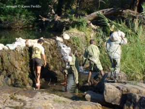 JR and the scouts fixing the weir